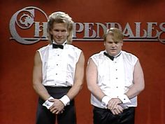 two men in tuxedos standing next to each other with their hands on their hips