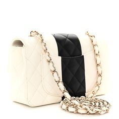 This is an authentic CHANEL Lambskin Quilted Mini Rectangular Flap in White and Black. The chic mini crossbody classic is crafted in soft quilted lambskin leather in black and white. The bag features a light gold chain link leather threaded shoulder strap and a light gold classic CC turn lock. This opens the flap to a white leather interior with zipper and patch pockets. Chanel Mini Rectangular, Jersey Quilt, Classic Phones, Chanel Crossbody, Chanel Mini, Chanel Shoulder Bag, Leather Thread, Chanel Caviar, Dark Beige