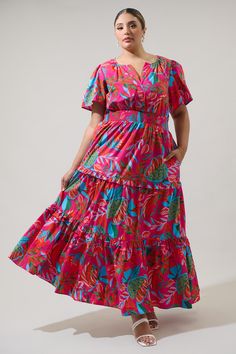 Our most loved Palmer Poplin Tiered Dress is back and now in this divine pink and red multi color floral print that adorns this favorite maxi dress! A classic silhouette features a split neckline framed by flowy short sleeves. The bodice is relaxed, while the waist is smocked. Side seam pockets are added to a ruffle trim, tiered maxi skirt. Add on heels to complete your look!- Tiered- Smocked waist- Pockets- Ruffle details- Color: Red MultiSize + Fit - Model is 5'10" and wearing size 2X- Measure Cactus Blossom, Tiered Maxi Skirt, Flowy Shorts, Tiered Maxi Dress, Pink And Red, Off Black, Classic Silhouette, Tiered Dress, Cotton Style