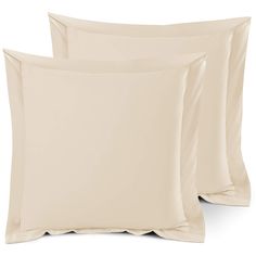 two pillows and one pillow case are shown in beige color, with the covers folded down