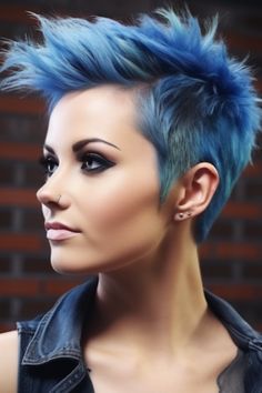 Embrace an edgy and vibrant look with an electric blue pixie styled into a faux hawk. This punk-inspired haircut is perfect for those who want to make a statement. Click here to check out more cute pixie haircuts trending for 2023. Pixie Haircut Blue Hair, Bold Hair Color For Short Hair, Fauxhawk Pixie, Punk Pixie Haircut, Unique Short Hair, Pixie Cuts For Wavy Hair, Cuts For Wavy Hair, Trending For 2023