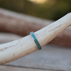 a close up of a piece of wood with a ring on it's end