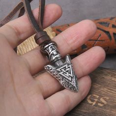 Introducing our Valknut Silver Color Viking Spear Pendant Necklace, a powerful symbol of courage and destiny. Crafted with meticulous detail, this pendant features the iconic Valknut, a revered emblem associated with Norse mythology, intertwined with the classic Viking spear design. Made with high-quality materials, our pendant exudes strength and elegance. Whether you're a devotee of Norse culture, seeking a bold statement piece, or simply drawn to the mystique of Viking symbolism, this necklac Viking Style Metal Necklace For Gift, Adjustable Viking Style Jewelry Gift, Viking Style Nickel Free Necklace Gift, Viking Style Nickel Free Necklace For Gift, Viking Style Nickel Free Necklaces For Gift, Nickel Free Viking Necklaces As Gift, Viking Style Adjustable Necklace Gift, Viking Style Adjustable Necklace As Gift, Viking Pendant Jewelry Gift