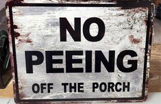 a sign that says no peeing off the porch