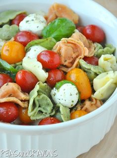 a white bowl filled with lots of different types of food