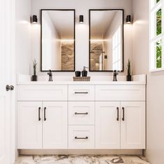 a bathroom with double sinks and mirrors on the wall