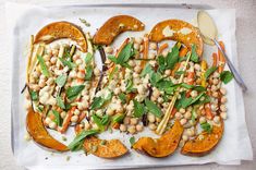 a white plate topped with squash and chickpeas