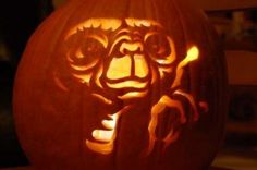 a carved pumpkin with an image of a cat on it's face and eyes