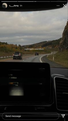 a car driving down the road in front of another car on it's dashboard