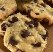 chocolate chip cookies on a cutting board ready to be eaten