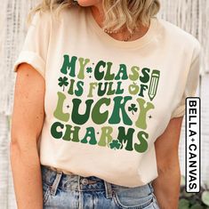 "St Patrick's Day Teacher Shirt, My Class Is Full Of Lucky Charms, Cute Teacher Gift, Teacher Appreciation Tee, Teacher Life, New Teacher Tee Welcome to LunaTeeApparel ☺️ Our shirts are clean, high quality and soft. It is prepared quickly by our boutique Ironing and shipped. Enjoy your shopping It is a pleasure for us to help you with your questions and you can reach us at any time. Please, don't forget to check our size cards. HOW TO ORDER SHIRT 👕 Please, choose your favorite t-shirt color and size from the pop-up window. Select the quantity that you want. Click \"ADD TO CART\" You can go back to add more product color for your loved ones members. You can complete the checkout process Please \"Click Proceed to Check Out\" Finally, you have completed all the steps, your product will be pr St Patricks Day Shirts For Teachers, St Patrick’s Day Teacher Shirts, Green Graphic Tee With Lettering, Green Cotton T-shirt With Lettering, Cute Teacher Gifts, Teacher Wardrobe, Lunch Lady, Text Shirt, New Teacher