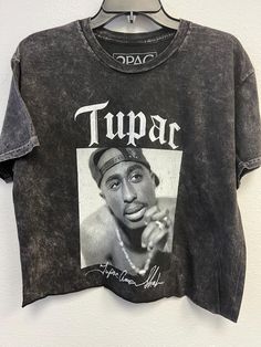 Tupac Shakur Leaning Pose with Signature Oversized Crop-Officially Licensed (Rhinestones Optional-see details below) - 100% Cotton Fabric - Adult Oversize Crop Tee  - Black Colored tee, Mineral Wash - Available in two sizes that fit most: S/M & L/XL - OPTIONAL RHINESTONES: Crystal colored rhinestones outline name Tupac on garment. Select "No Rhinestones" or "Rhinestones" at checkout (see listing photos for rhinestone option). - Fit: the length measurements are approximate due to the process appl 90s Acid Wash Tops For Streetwear, Tupac Signature, Leaning Pose, Tupac Tee, All Eyez On Me, Tupac Shakur, Cropped Tube Top, Tupac, Crop Tee