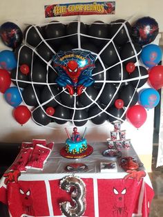 a spiderman themed birthday party with balloons