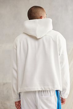 Standard Cloth Jump Shot hoodie in a classic pullover style. Oversized fit sweatshirt with a cropped hem. Cut from a cozy cotton blend and includes an adjustable drawcord at the hem. Urban Outfitters exclusive. Features Standard Cloth Jump Shot hoodie sweatshirt Pullover style with a hood Cotton poly blend Front pouch pocket Elastic cuffs Oversized & cropped Adjustable drawcord hem Cropped length UO exclusive Content + Care 65% Cotton, 35% polyester Machine wash Imported Size + Fit Model in Blue