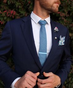 The Twilight Blue and Periwinkle Floral Tie and Sock Groom Set features hand-chosen high-quality components and is the perfect accessory for any occasion. This set has everything you need to make multiple looks by mixing and matching. Styled by top designers, the set is tailored to match the latest wedding color trends. Get ready for the wedding season with this two tie set. This Tie Set Comes with: 2 High Quality, Modern Width, Linen Cotton Blend Ties Matching Pocket Square with Stitched Edging Navy Blue Suit With Floral Tie, Blue Floral Tie Groomsmen, Light Blue Floral Tie, Blue Floral Tie, Adjustable Blue Floral Print Tie, Twilight Blue, Floral Socks, Tie Matching, Wedding Color Trends