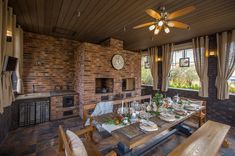 the dining room table is set with plates and place settings for two people to eat