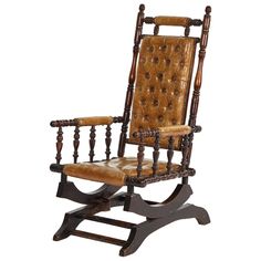 an old wooden rocking chair with brown leather upholstered back and arms, on a white background