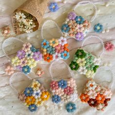 small crocheted flowers are arranged on a table