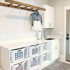 the laundry room is clean and ready to be used as a mudroom for children