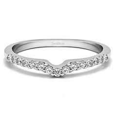 a white gold wedding band with diamonds on it