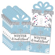 six blue and silver christmas gift bags with snowflakes on the front, one is for