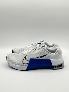 Elevate your training with the Nike Men's Metcon 9 in size 13, featuring a sleek white and blue colorway (style code: DZ2617-100). Designed for athletic performance, this sneaker is perfect for any man looking to boost their training regime. With a sturdy build and Nike Train product line, you'll feel confident and supported during any workout. This shoe is brand new and comes with its original box. The Nike Men's Metcon 9 is a must-have for all athletes, especially those looking to take their training to the next level. Don't miss out on this opportunity to elevate your game. Athletic Performance, Men Looks, Feel Confident, Size 13, White Blue, Nike Men, Athletic Shoes, Original Box, The Next