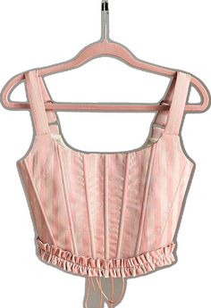 Feminine Pink Underbust Corset, Pink Underbust Feminine Corset, Pink Feminine Underbust Corset, Pink Ruffled Corset For Spring, Spring Pink Ruffled Corset, Spring Pink Corset With Ruffles, Pink Sleeveless Corset For Spring, Feminine Overbust Corset With Ruffles, Pink Underbust Corset Dress With Fitted Bodice