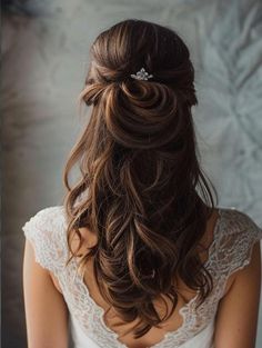 a woman with long hair wearing a white dress and a tiara on her head