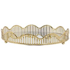 a gold metal tray with wavy lines on the bottom and sides, set against a white background