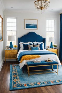 a bedroom with blue and yellow accents, white walls and wood flooring is pictured in this image