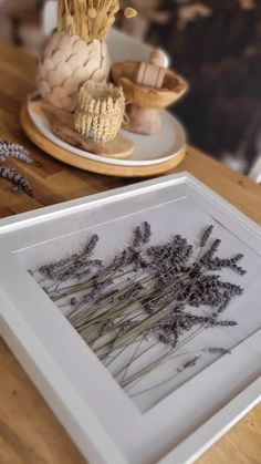 some dried flowers are sitting on a table