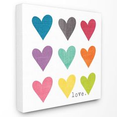 colorful hearts with the word love painted on them in different colors and sizes canvas wall art print