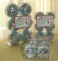 there are many shiny balls in the package on the table and one is for sale