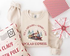 Polar Express Shirt, Xmas Crewneck Sweater, Polar Express Sweatshirt, Christmas Gift For Family, Merry Christmas Hoodie, Christmas Gift Idea Welcome to TeeDesignUS! We have selected the most special products for you and are at your service. We are here for everything you need. We wish you pleasant shopping! Product Details: -Double-needle stitching on collar, shoulders, armholes, cuffs, and hem for enhanced durability. -1 x 1 rib with spandex for a comfortable and flexible fit. -Crewneck design for a classic look. -Relaxed fit suitable for both men and women. -Made from 50% cotton and 50% polyester blend for a balanced combination of comfort and durability. HOW TO ORDER 1- Please review all photos, 2- Choose your size and color from the drop-down menus, 3- Click the "add to cart" button, 4 Polar Express Sweatshirt, Christmas Gift For Family, Christmas Hoodie, Crewneck Design, Polar Express, Family Christmas Gifts, Christmas Hoodies, Christmas Gift Idea, Sweatshirt Christmas