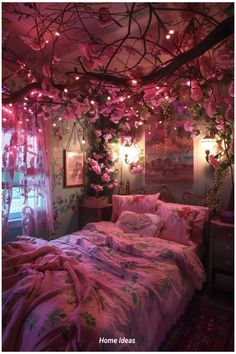 a bed with pink comforter and pillows in a room decorated with flowers on the ceiling