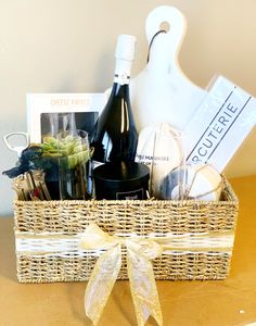 a wicker basket filled with wine bottles and other items