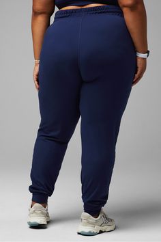 High-Waisted Performance Jogger Fabletics blue female Activewear >> Womens >> Bottoms >> Pants & Joggers >> Joggers PureLuxe Lite plus Everyday/Training 4-Way Stretch/Breathable/External Pocket/Moisture-Wicking/UPF Protection Jogger in ultra-soft PureLuxe Lite. Athleisure Loungewear Bottoms With Contoured Waistband, Navy Stretch Activewear For Loungewear, High Waist Stretch Joggers For Loungewear, Stretch High Waist Joggers For Loungewear, Navy Athleisure Bottoms With Elastic Waistband, Navy Athleisure Bottoms With Ribbed Waistband, Blue Workout Bottoms With Ribbed Waistband, Blue Athleisure Bottoms With Wide Waistband, Blue 4-way Stretch Yoga Pants With Elastic Waistband