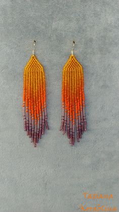 These unique handmade earrings are made of high-quality Czech beads and strong synthetic thread. They are elegant, fashionable, and highly versatile, suitable for everyday wear. Color: orange, purple . There may be some color discrepancies which is due to the different monitor settings I will make these earrings for you in your favorite size. 100% hand made with love! Measurements: Length-about 10,5cm (4.13 inch) Width -about 2 cm (0.79 inch) Materials: Sterling silver components Czech glass bea Handwoven Orange Beaded Earrings For Gift, Handwoven Orange Beaded Earrings As Gift, Orange Handwoven Dangle Beaded Earrings, Adjustable Orange Beaded Fringe Earrings, Orange Beaded Dangle Tassel Earrings, Adjustable Orange Tiny Beads Earrings, Orange Beaded Fringe Earrings With Round Beads, Beaded Orange Tassel Earrings As Gift, Handmade Purple Tassel Earrings With Round Beads