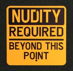 a yellow and black sign that says, nudity required beyond this point