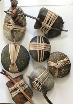 some rocks and sticks are wrapped in twine