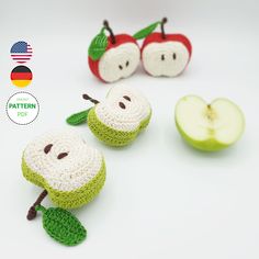 crocheted apples with faces and leaves on them