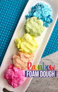 rainbow foam dough on a tray with the words rainbow foam dough in front of it