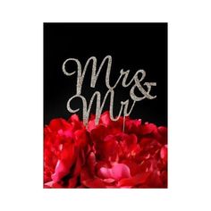 a cake topper with the word mrs and mr on it surrounded by red flowers