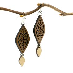 "A Moroccan tile-inspired design gives these earrings a worldly vibe, and a dangling charm adds elegance. Two tones of intricately cut wood - walnut and maple - give additional texture to the piece. Laser cut wood earrings can be dressed up or down, making them the perfect complement to any outfit! These earrings are strong but so lightweight and comfortable, you will hardly know you have them on! Pair with the matching Moroccan necklace for a coordinated look: https://www.etsy.com/listing/81235 Elegant Brown Plug Earrings As Gift, Elegant Brown Plug Earrings For Gift, Moroccan Necklace, Laser Cut Wood Earrings, Laser Cut Earrings, Cut Earrings, Moroccan Tile, Silver Earrings Handmade, Printed Jewelry