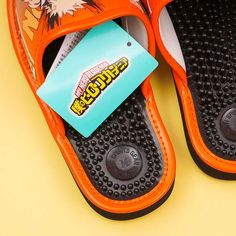 Slip on this pair of orange slippers when indoors to keep your feet warm! These are made of rubber and faux leather and have prints of Katsuki Bakugo from the action animé, “My Hero Academia!” Each medium-sized sandal also has many acupressure points on the insole which massages the feet and aids in improved circulation. A orange pair of medium acupressure slippers featuring Katsuki Bakugo of My Hero Academia Features acupressure points on the insole Made of faux leather and rubber sole Heel hei Orange Non-slip Casual Slippers, Orange Flat Synthetic Slippers, Orange Synthetic Flip Flops, Comfortable Orange Slides With Round Toe, Comfortable Orange Round Toe Slides, Orange Slippers, Katsuki Bakugo, Acupressure Points, Acupressure