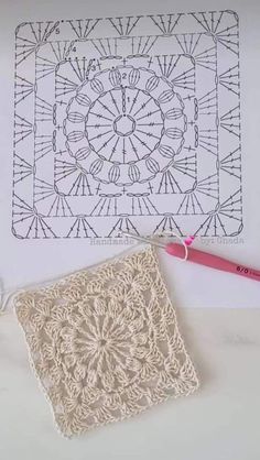 a crochet doily is laying on top of a piece of paper