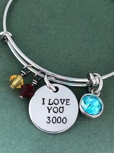 i love you 30000 charm bracelet with swarong charms on the side and an adjustable clasp