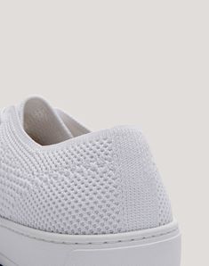 The classic clean white sneaker. This reimagined staple shoe features a relaxed silhouette, and goes beyond looks: its single-layer knit upper is fully breathable and the ultra-light sole makes this your perfect companion for city explorations. A minimalist design with maximal comfort. Comfortable White Slip-on Sneakers With Rubber Waffle Outsoles, Everyday White Textile Sneakers, Comfortable Low-top Knit Sneakers, Lightweight White Sneakers With Round Toe, White Lightweight Sneakers With Round Toe, White Lightweight Round Toe Sneakers, White Textile Slip-on Sneakers With Speckled Midsole, Comfortable White Sneakers With Woven Sole, Lightweight White Sneakers With Rubber Sole