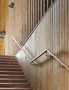 the stairs are made of wood and have metal handrails