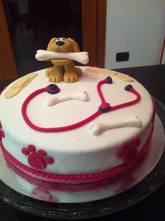 a cake decorated with a dog and a stethoscope